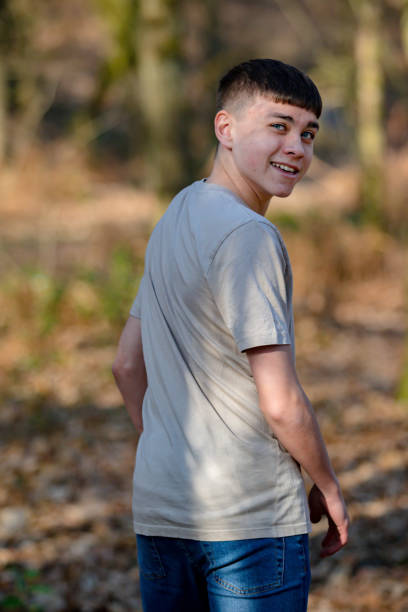 istock Teenage boy outside on a bright Spring day 1133027256