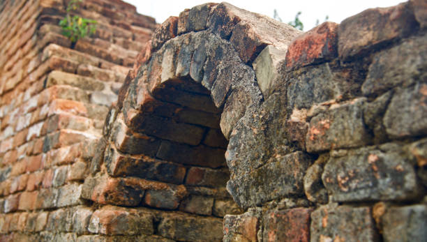 istock Old bricks made protection wall of a building 1133027276