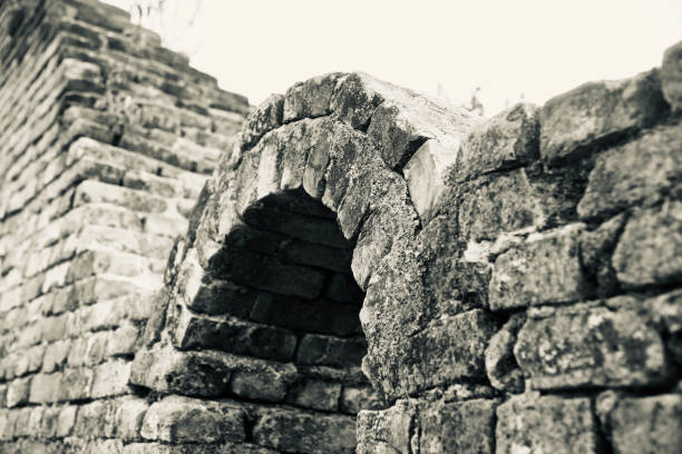 istock Old bricks made protection wall of a building 1133027290