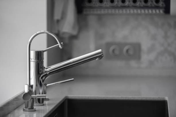 istock Minimalistic kitchen corner with appliances. Water tap in the kitchen 1133032954