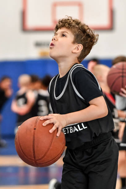 istock Little boy playing basketball 1133033229