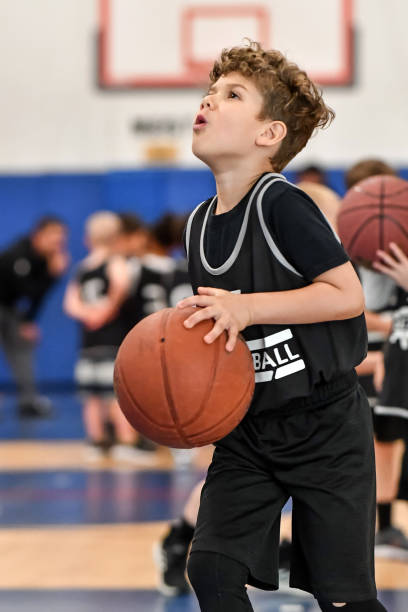 istock Little boy playing basketball 1133033231