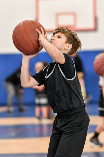 istock Little boy playing basketball 1133033245