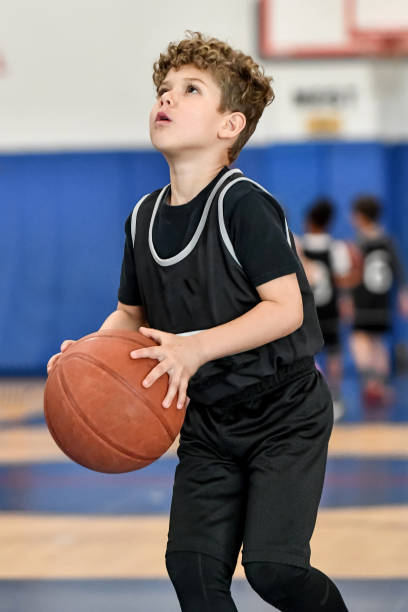 istock Little boy playing basketball 1133033257