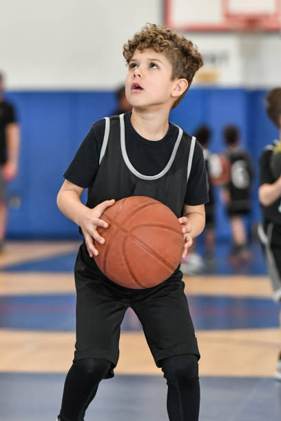 istock Little boy playing basketball 1133033258
