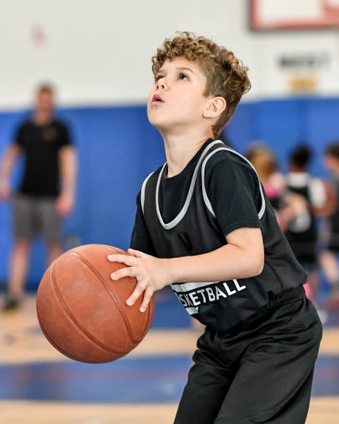 istock Little boy playing basketball 1133033264