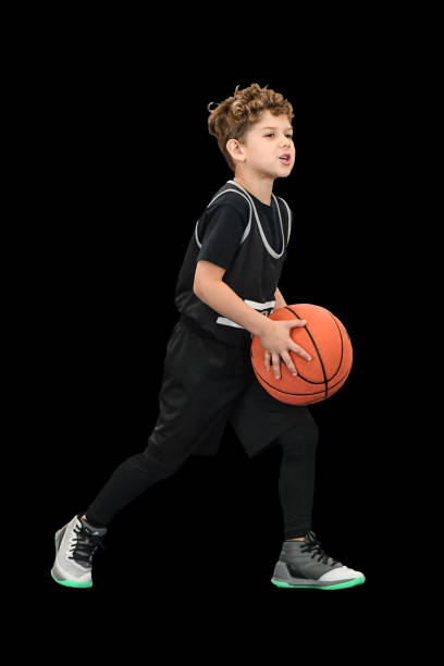 Little boy playing basketball