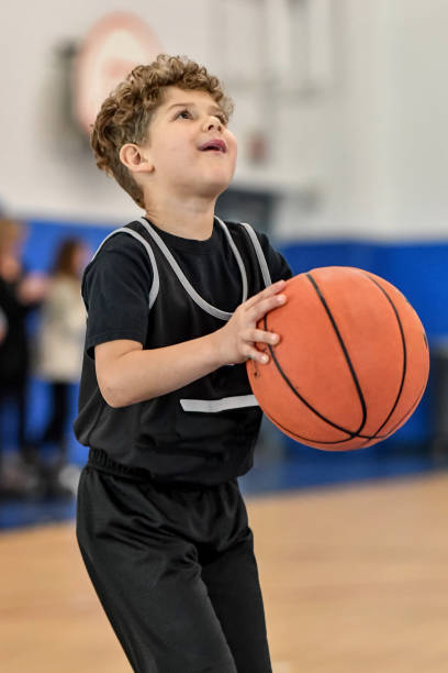 istock Little boy playing basketball 1133033299