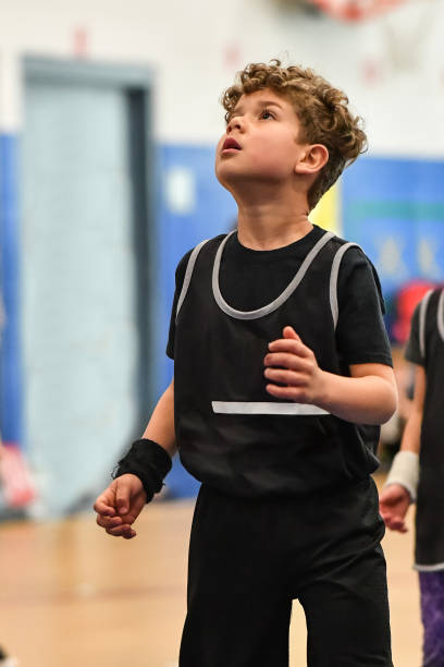 istock Little boy playing basketball 1133033324