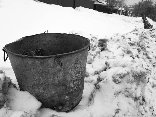 istock beautiful vintage garbage can on snow 1133034223