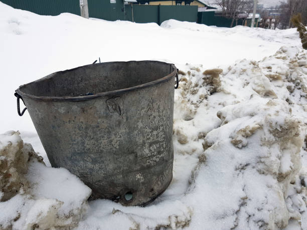 istock beautiful vintage garbage can on snow 1133034318