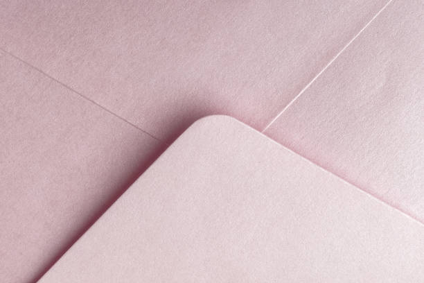istock Abstract background in pink color. Detail envelope close up. 1133034398
