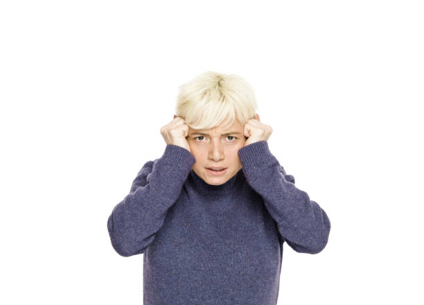 istock Mid adult women looking at camera with a shock expression 1133035846