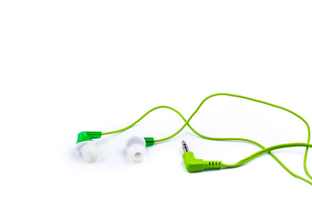 istock Green headphones on white 1133036472