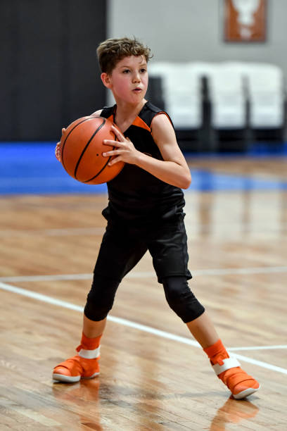 istock Young boy playing basketball 1133037254