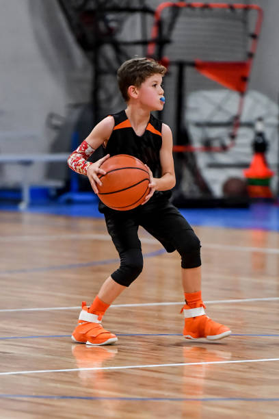 istock Young boy playing basketball 1133037259