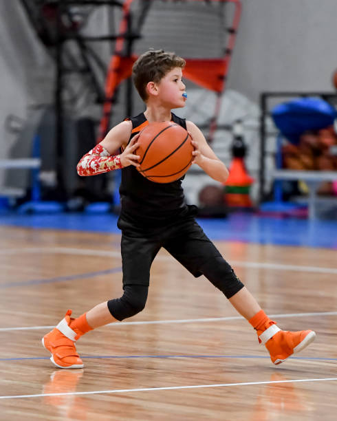 istock Young boy playing basketball 1133037267