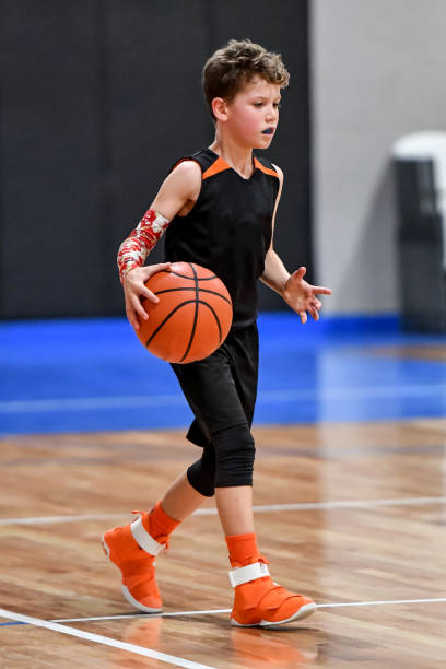 istock Young boy playing basketball 1133037287