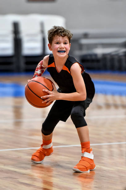 istock Young boy playing basketball 1133037353