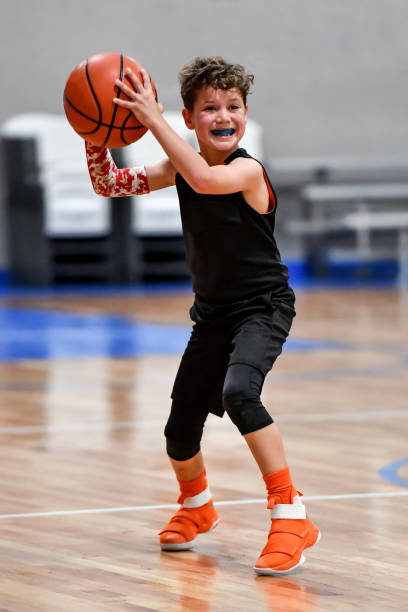 istock Young boy playing basketball 1133037381