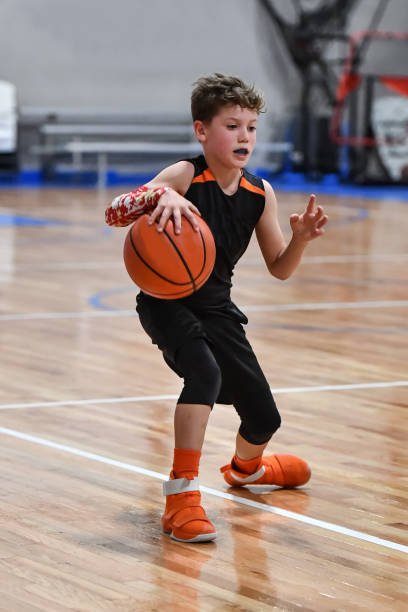 istock Young boy playing basketball 1133037411