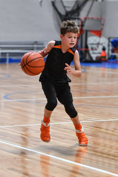 istock Young boy playing basketball 1133037414