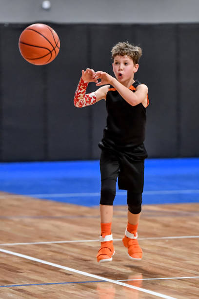istock Young boy playing basketball 1133037429