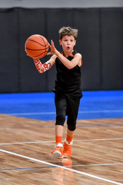 istock Young boy playing basketball 1133037445