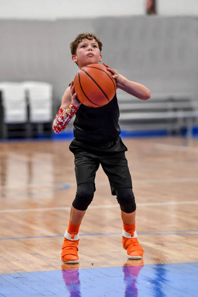 istock Young boy playing basketball 1133037605