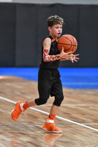 istock Young boy playing basketball 1133037609