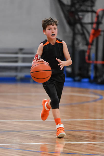 istock Young boy playing basketball 1133037641