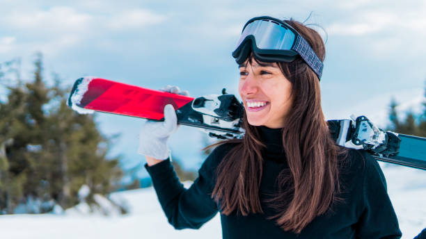istock Happy skier holding skis 1133038416