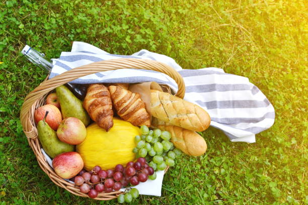istock Basket with Food Fruit Bakery Cheese Ham Tomato Picnic 1133039752