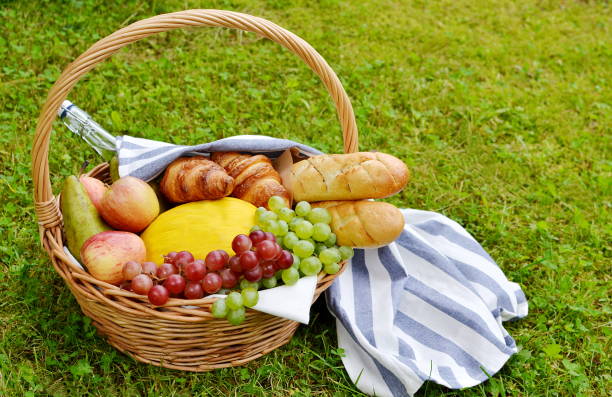 istock Basket with Food Fruit Bakery Cheese Ham Tomato Picnic 1133039764