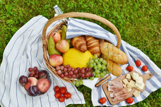 istock Basket with Food Fruit Bakery Cheese Ham Tomato Picnic 1133039771