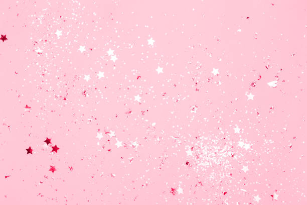istock Pink confetti and stars and sparkles on pink background. 1133041175