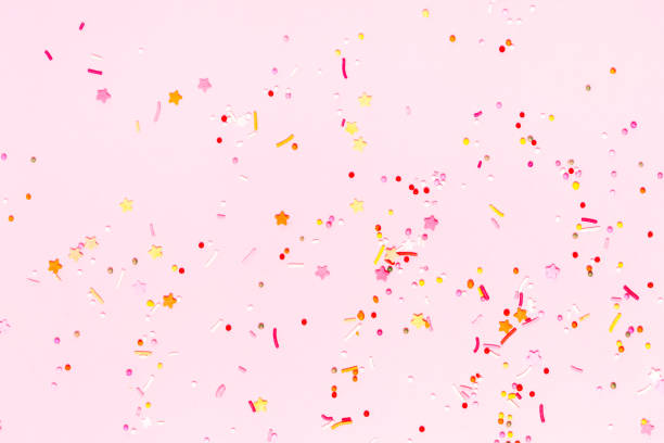 istock Pink confetti and stars and sparkles on pink background. 1133041200