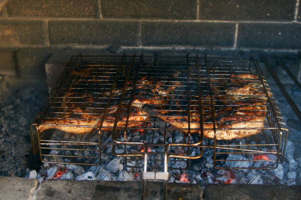 istock Grilled chicken Tabaka on the flaming grill 1133044649