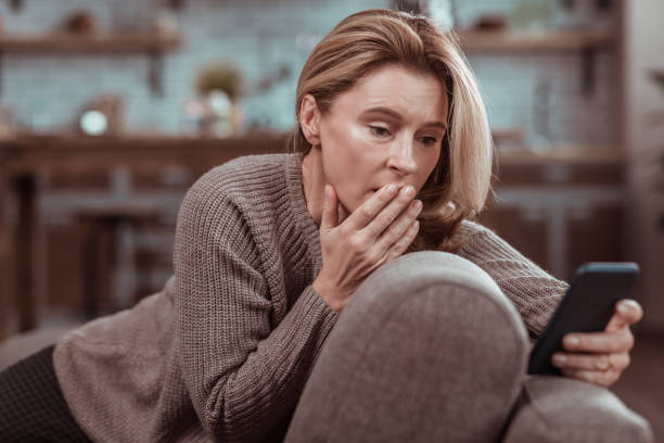istock Woman feeling emotional after seeing message from husband 1133047619