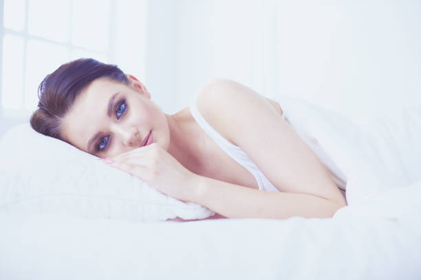 istock Young beautiful woman lying in bed. 1133051406