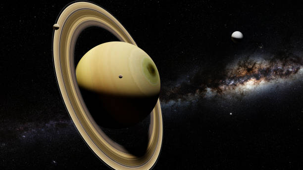 istock the planet Saturn with moons including Enceladus and the galaxy 1133055153