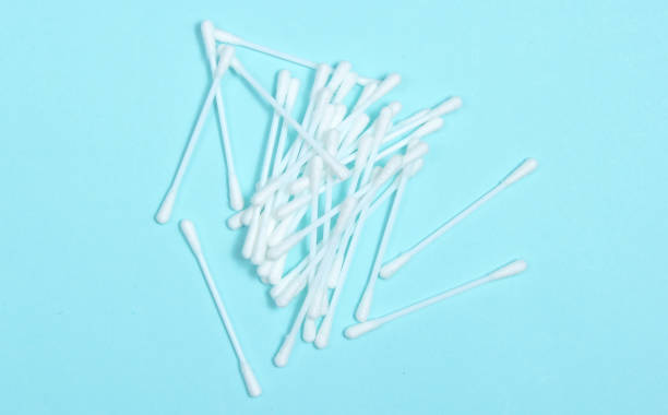 istock Ear hygiene cotton stick on blue background. 1133055784