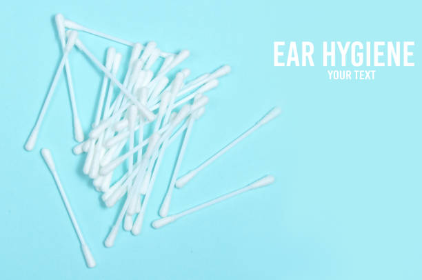 istock Ear hygiene cotton stick on blue background. Copy space. 1133055796