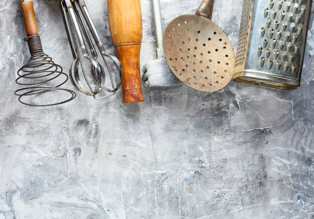 istock Old kitchen tool on grey concrete background. Retro kitchen, vintage cooking tool set. Top view 1133056093