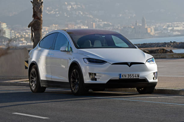 Tesla Model X on the street Sitges, Spain - 26th February, 2019: Tesla Model X parked on the street. This model is the first SUV from Tesla brand. The electric Model X has all-wheel drive and seating for seven adults. tesla model x stock pictures, royalty-free photos & images