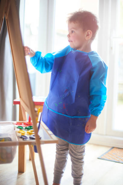 istock Concentrating on his painting 1133063398