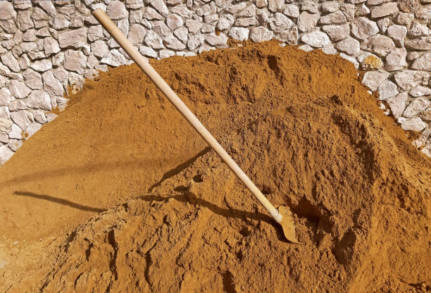 istock Construction sand and a shovel in the sand 1133069096