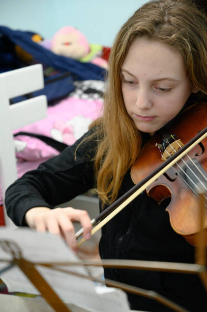 istock Girl playing violin 1133075350