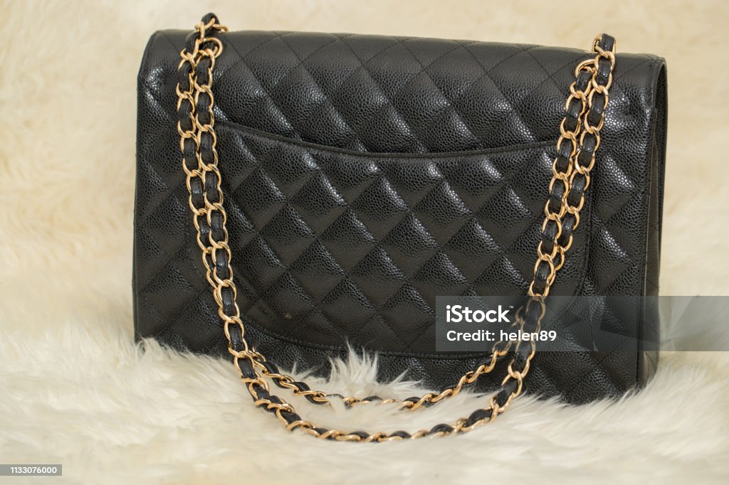 Photo Of Black Handbag On The Table Stock Photo - Download Image