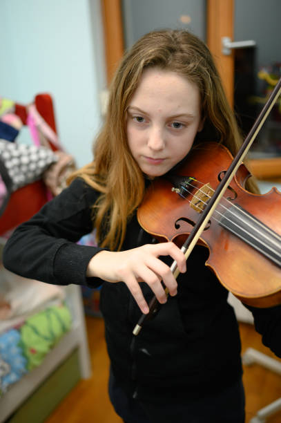 istock Girl playing violin 1133076001